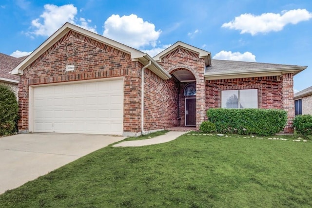 view of front of home with a garage and a front lawn