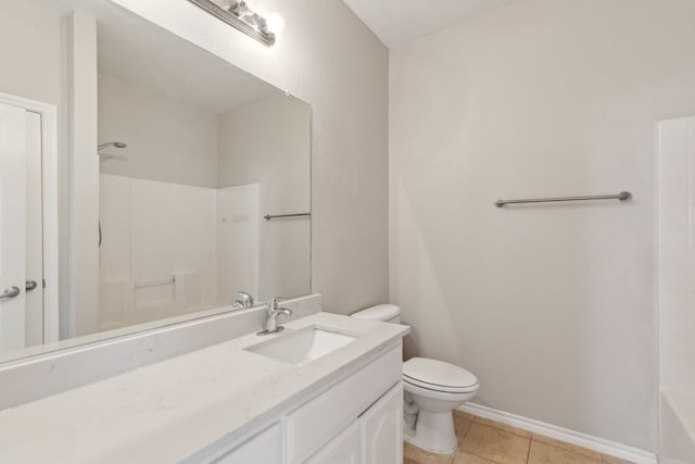 bathroom with vanity, tile patterned floors, and toilet