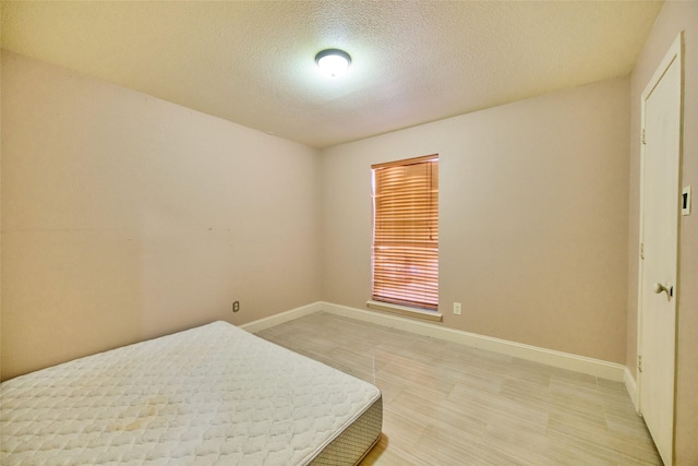 bedroom featuring a textured ceiling