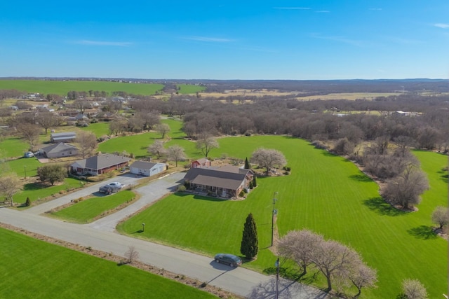 ranch-style home featuring a lawn