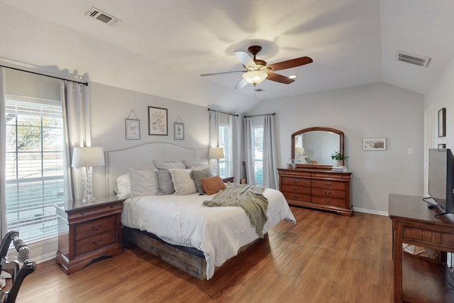 bedroom featuring wood-type flooring, ceiling fan, and vaulted ceiling