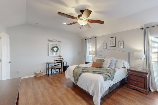 bedroom with hardwood / wood-style flooring, lofted ceiling, and ceiling fan