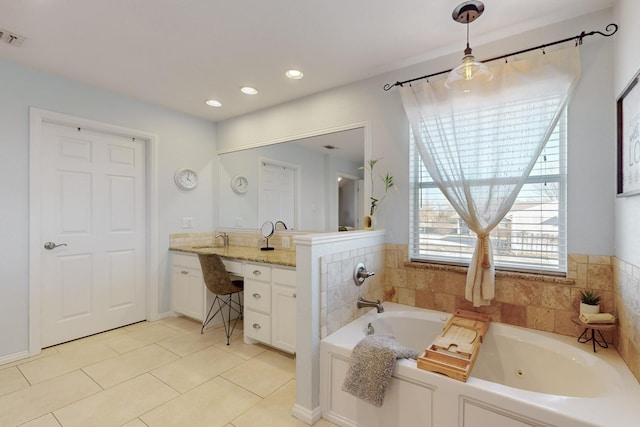 bathroom with vanity, a tub to relax in, and tile patterned floors