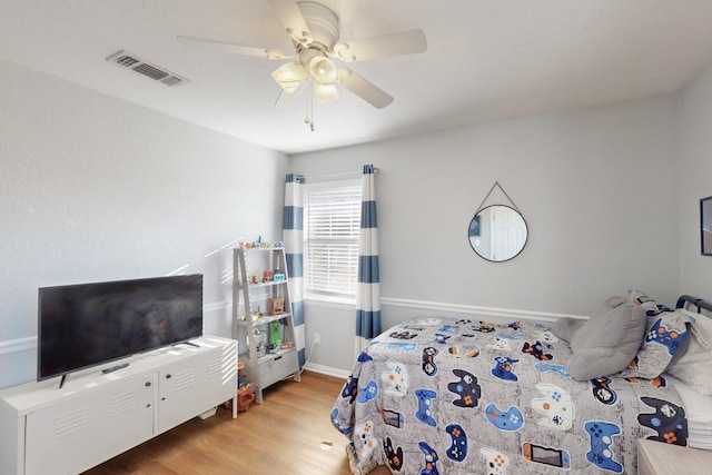 bedroom featuring ceiling fan and light hardwood / wood-style flooring