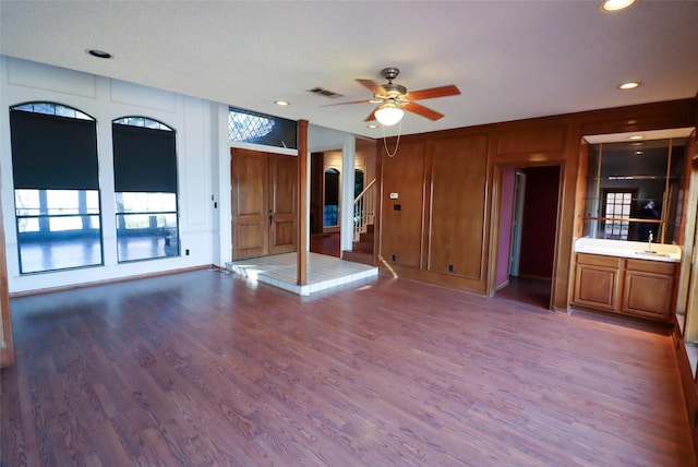 empty room with hardwood / wood-style flooring, sink, a textured ceiling, and ceiling fan