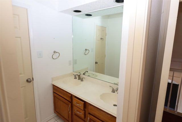 bathroom with tile patterned floors and vanity