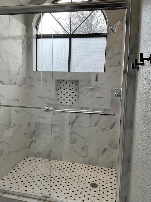 bathroom featuring walk in shower