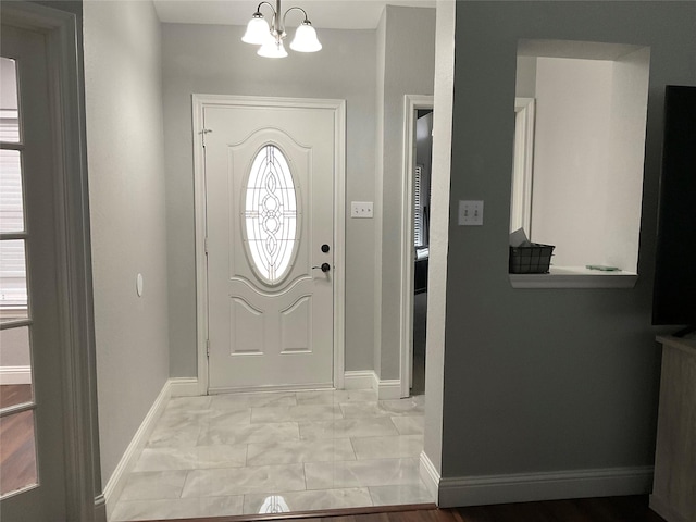 entrance foyer featuring a chandelier