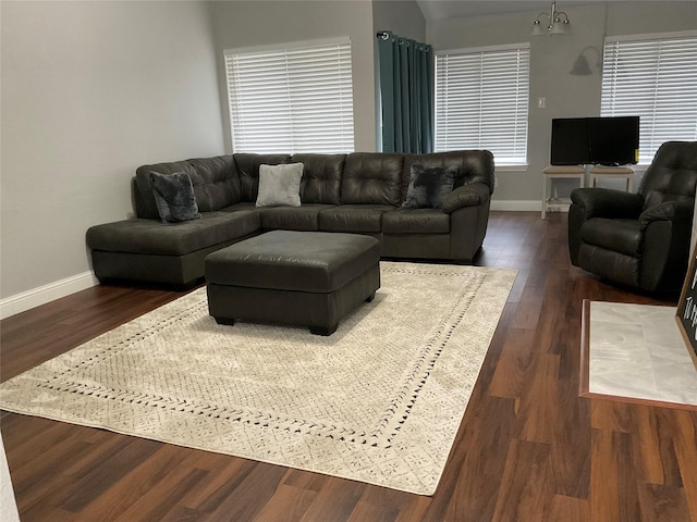 living room with dark hardwood / wood-style flooring