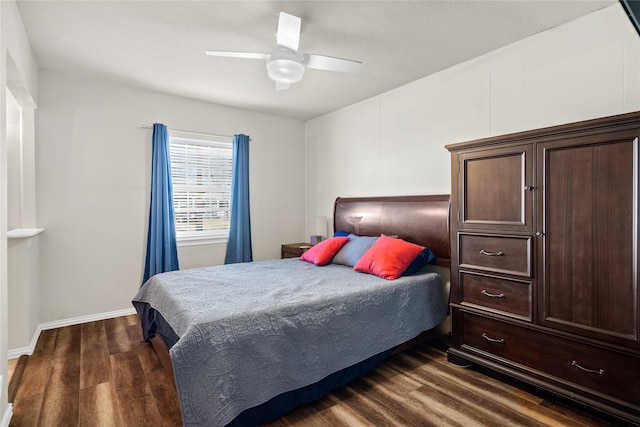 bedroom with ceiling fan and dark hardwood / wood-style flooring