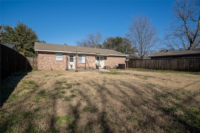 back of house with a yard