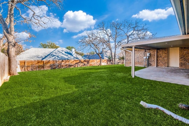 view of yard with a patio and a fenced backyard