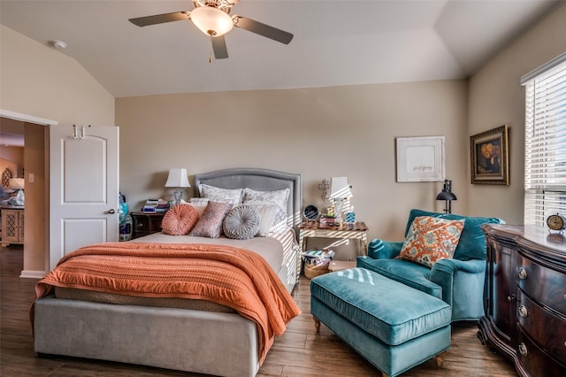 bedroom with ceiling fan, dark hardwood / wood-style flooring, and lofted ceiling