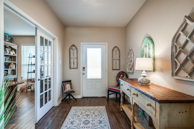 foyer with dark wood-type flooring and french doors