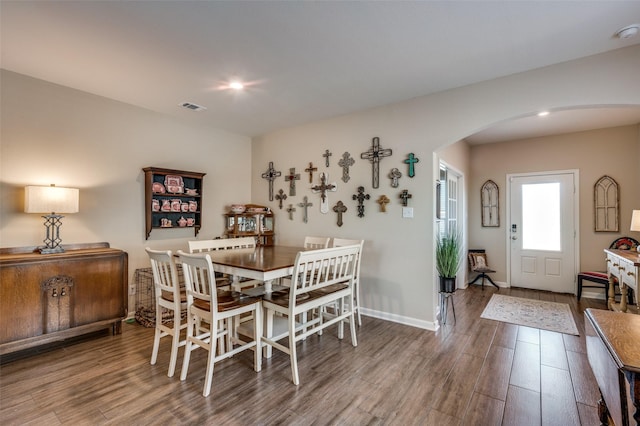 dining room with hardwood / wood-style floors