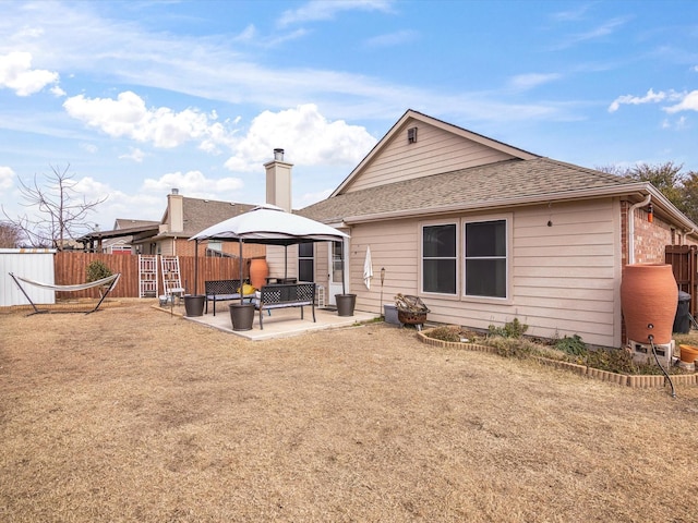 back of house featuring a patio area and a gazebo