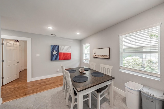 dining space featuring light hardwood / wood-style floors