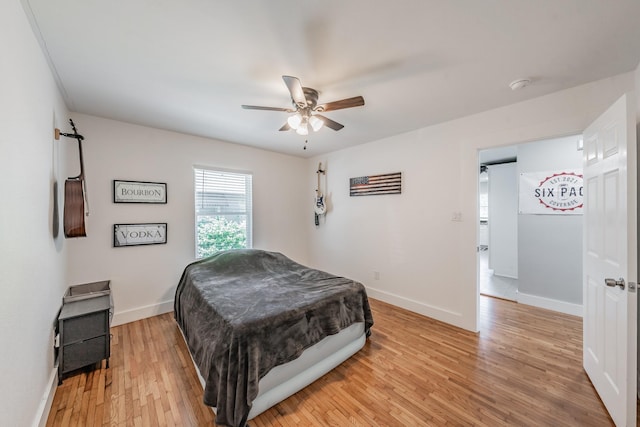 bedroom featuring ceiling fan and light hardwood / wood-style floors