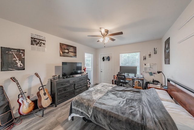 bedroom featuring ceiling fan and light hardwood / wood-style floors