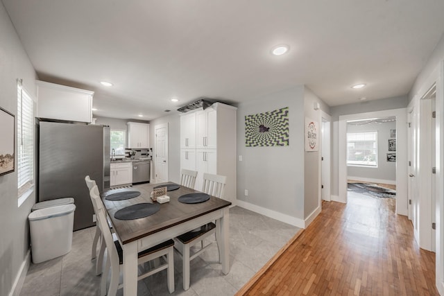 dining room with light hardwood / wood-style floors