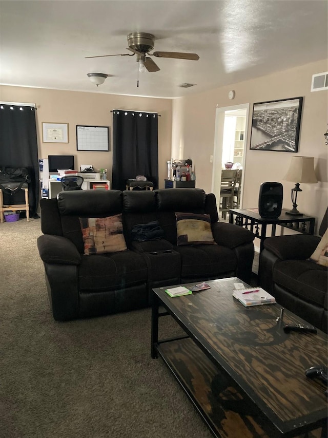 living room with ceiling fan and carpet flooring