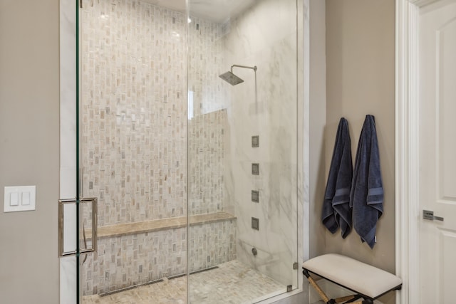 bathroom with a shower with shower door