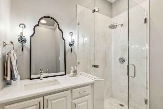 bathroom with an enclosed shower and vanity