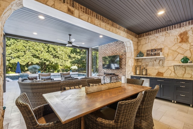 view of patio / terrace with ceiling fan, a swimming pool, and an outdoor living space