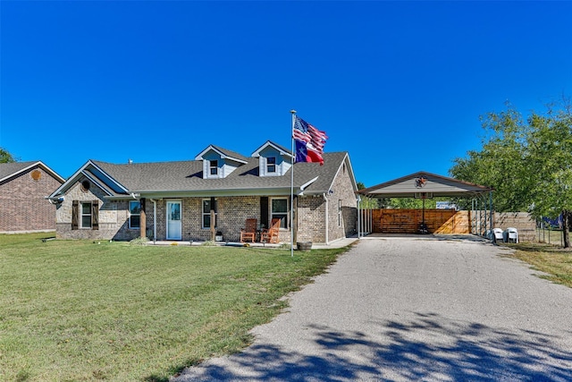 view of front of house featuring a front yard and a carport