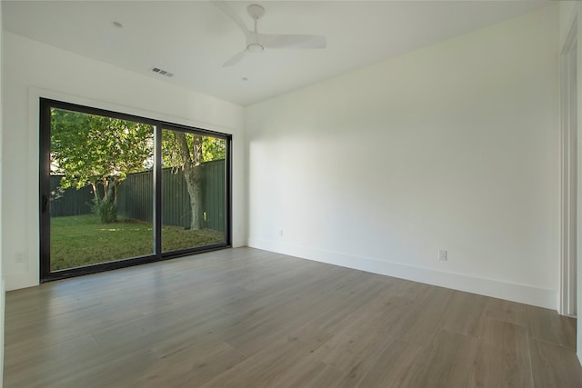 spare room featuring ceiling fan and wood-type flooring