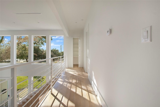 sunroom featuring beam ceiling