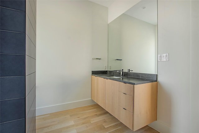 bathroom featuring vanity and hardwood / wood-style floors