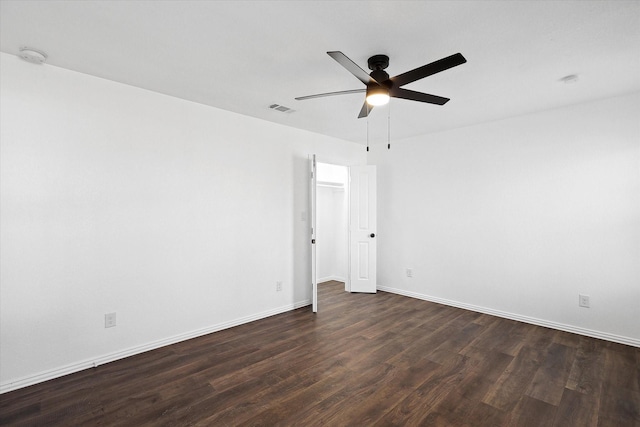 unfurnished room with ceiling fan and dark hardwood / wood-style floors