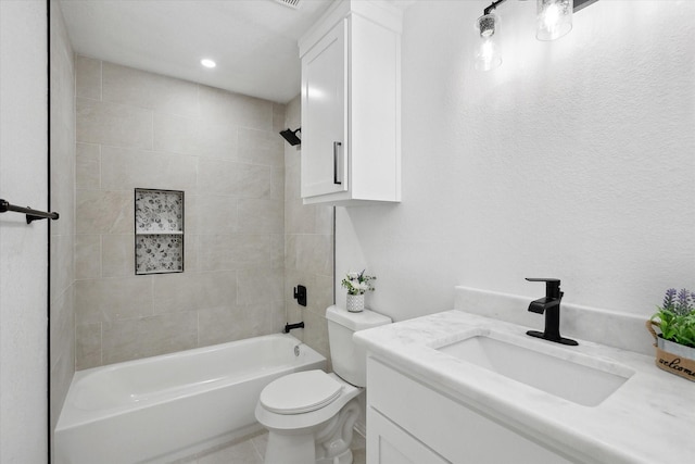 full bathroom featuring toilet, vanity, and tiled shower / bath combo