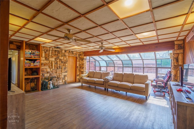 living room featuring ceiling fan, light hardwood / wood-style flooring, and coffered ceiling