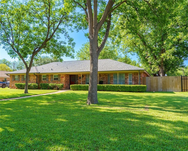 ranch-style house with a front lawn