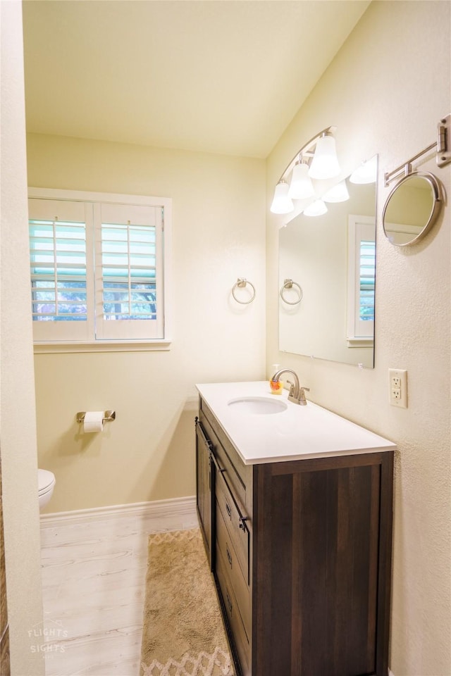 bathroom featuring toilet and vanity