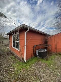 view of property exterior with central AC unit