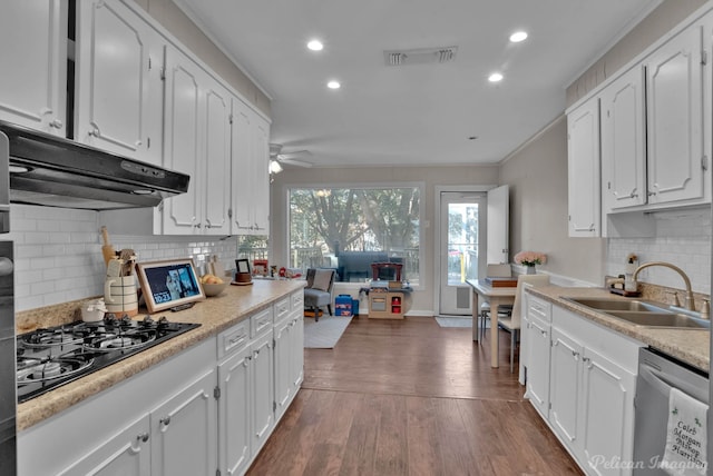 kitchen featuring white cabinetry, stainless steel dishwasher, black gas stovetop, and sink