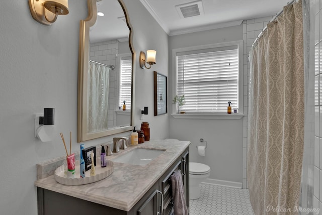 bathroom with tile patterned floors, toilet, vanity, and ornamental molding