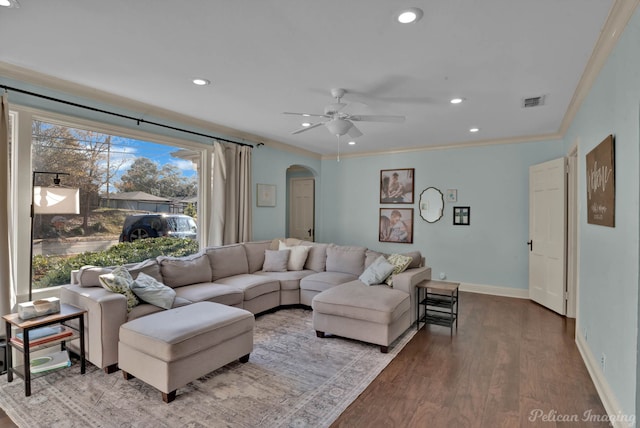 living room featuring ceiling fan, crown molding, and hardwood / wood-style floors