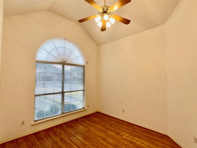 spare room with ceiling fan, wood-type flooring, and lofted ceiling