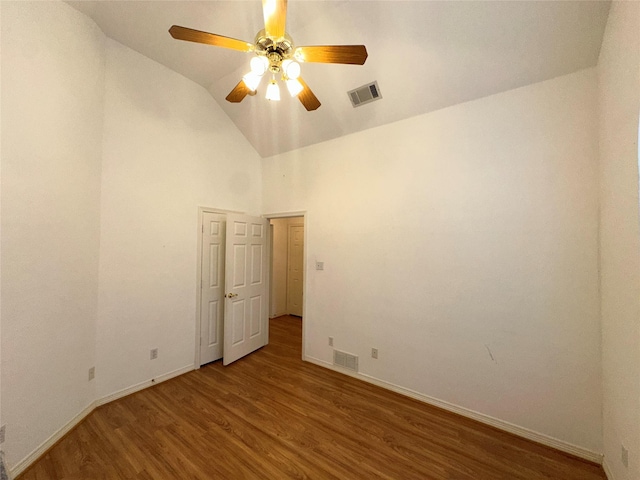 spare room featuring vaulted ceiling, ceiling fan, and hardwood / wood-style flooring