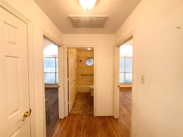 hall with dark hardwood / wood-style floors