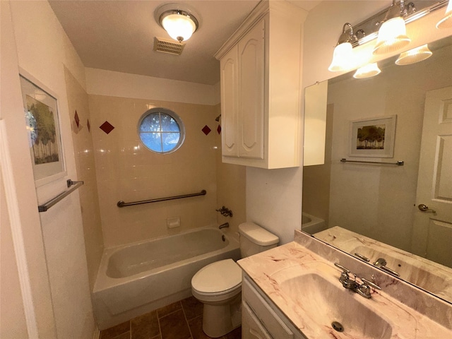 bathroom featuring toilet, vanity, and tile patterned floors