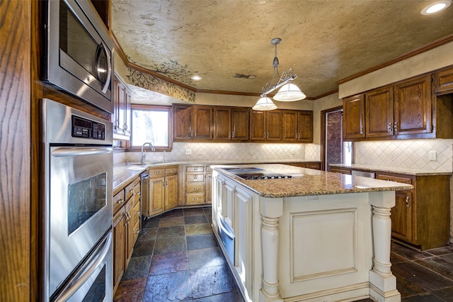 kitchen with crown molding, stainless steel appliances, decorative light fixtures, and sink