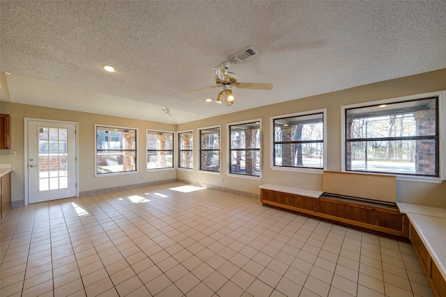 interior space with plenty of natural light and ceiling fan