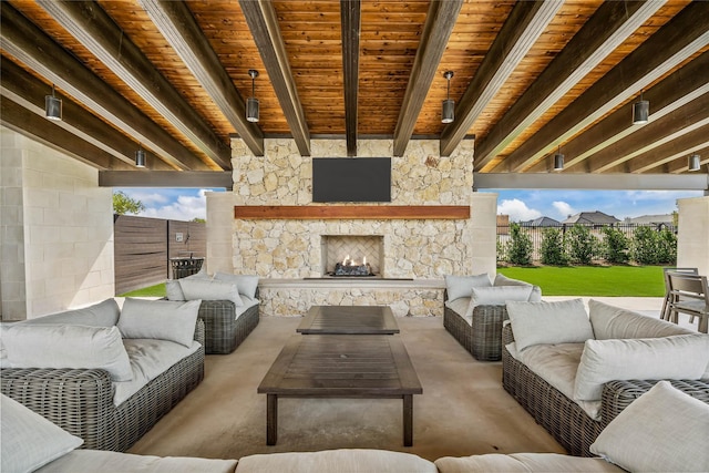 view of patio with an outdoor living space with a fireplace