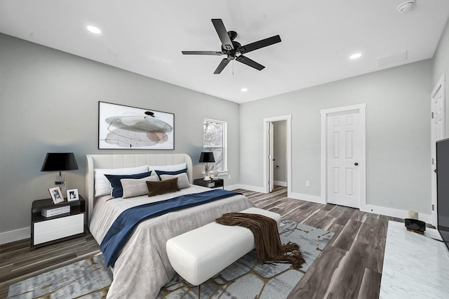 bedroom featuring dark wood-type flooring and ceiling fan