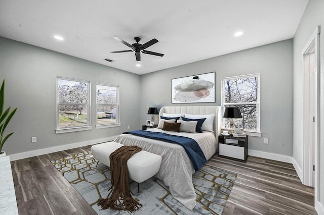 bedroom featuring dark wood-type flooring and ceiling fan